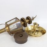 A brass-framed hexagonal carriage lantern, an Antique brass rise and fall chamber stick, and a