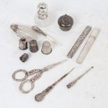 A group of Antique unmarked silver sewing items, including novelty tape measure, scissors, jars etc