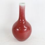A Chinese red flambe glaze bottle vase, 6 character Qianlong mark, height 22cm