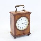 A Vintage walnut mantel clock, white enamel dial with Roman numeral hour markers, with lion mark