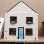 A large Vintage doll's house with some furniture and fittings, height 68cm