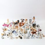 A large quantity of porcelain dog ornaments, including Wade