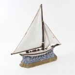 A painted cast-brass sailing ship doorstop, height 36cm