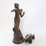 An Art Nouveau spelter figure of a lady, and an iron and brass table cannon (2)