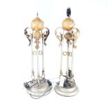 A pair of silvered and gold painted Renaissance style table lamps, height excluding fitting 60cm