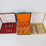 A cased set of mid-century stainless steel Viners teaspoons, and 2 other cased sets of cutlery