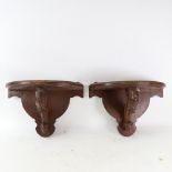 A pair of stained oak wall brackets, height 25cm, width 37cm