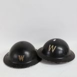 2 Second World War Period British Military steel Brodie warden helmets, black painted finish with