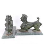 A pair of green painted cast-iron figural fire dogs/door stops, on veined green marble bases, base
