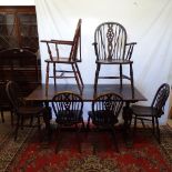 A rectangular oak refectory dining table, together with a set of 6 wheel-back dining chairs (4 and