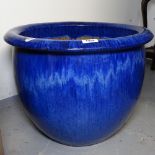 A blue glazed terracotta garden pot, W48cm, H37cm