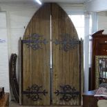 A pair of large Gothic oak arch-top doors, door height 280cm, width 72cm These were removed