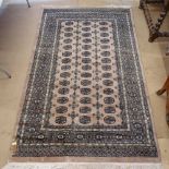 A cream ground Pakistani pure wool rug, 220cm x 151cm