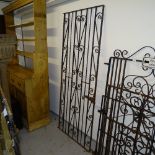 A scrolled wrought-iron garden gate, 71cm x 177cm