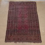 An Antique red ground Turkey Afghan rug, with symmetrical border, 160cm x 117cm