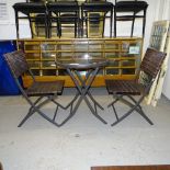 A small circular folding garden table, and 2 matching folding chairs