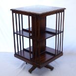 A reproduction crossbanded mahogany revolving bookcase, W50cm, H85cm