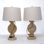 A pair of new limed-oak effect baluster table lamps and shades, height to top of shade 70cm