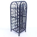 A modern scrolled wrought-iron arch-top 22 bottle wine cabinet, H87cm