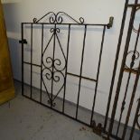 A scrolled wrought-iron garden gate, 93cm x 92cm