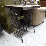 A square marble-top garden table, on a Singer sewing machine treadle base, W61cm, H75cm