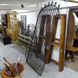 A large arch-top wrought-iron garden gate, width including hinge mount 97cm, height 230cm