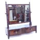 A Regency mahogany double serpentine-front box swing toilet mirror, with 2 short drawers, W61cm