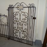 A scrolled wrought-iron gate, width including hinge mount 100cm, height 137cm