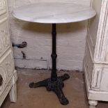 A circular white marble-top garden table on cast-iron base, W60cm, H71cm