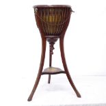 An Edwardian Empire style mahogany jardiniere stand, with metal liner, W36cm, H83cm