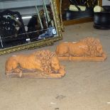 A pair of terracotta recumbent lions, L32cm