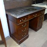 An Edwardian mahogany and satinwood-banded twin-pedestal writing desk, W110cm, H72cm, D65cm,