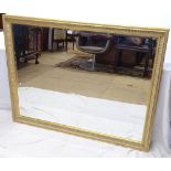 A large modern gilt-framed bevel-edge wall mirror, 134cm x 104cm