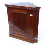 A small mahogany hanging corner cupboard, W70cm, H70cm