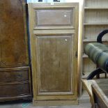 A Continental pine single-door larder cupboard, W70cm, H159cm, D54cm