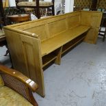 An early 20th century Gothic panelled pine pew, L223cm, H88cm, seat height 49cm