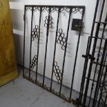 A scrolled wrought-iron side gate, 86cm x 108cm