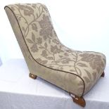 An upholstered slipper chair