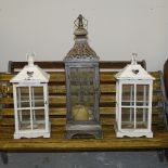 A pair of white painted lanterns, and a painted metal hanging lantern (3)