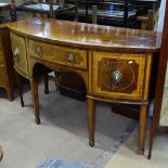 A Georgian crossbanded mahogany bow-front sideboard, with fitted drawer and cupboard, raised on 6