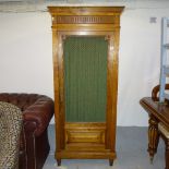 A Continental walnut cupboard, with a single mesh-panelled door, W73cm, H170cm, D38cm