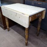 A Victorian pine Pembroke table, with end frieze drawer on turned legs, W91cm, D54cm, H77cm