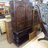 An 18th century oak larder cupboard on stand, having 2 fielded panelled carved doors, W109cm,