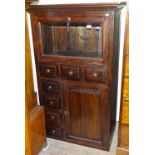 A hardwood side cabinet, with fall-front glazed door, and drawers under, W88cm, H147cm, D47cm