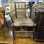 An Antique stained beech Sussex chair