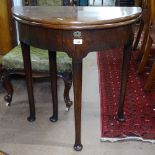 A George II mahogany demi-lune fold over tea table, W69cm, H73cm, D34cm