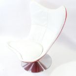 TERENCE CONRAN, British, Glove Chair, designed 2002, in red fibreglass and white leather on tilt and