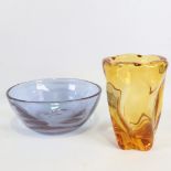 A mid-century heavy walled amber glass vase with twisted form and an optic moulded blown bowl,
