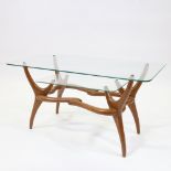 A mid-century Italian 2 tier glass coffee with organic sculptural base in walnut in the manner of