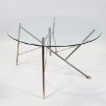 PHILIPPE STARCK, a Dole Melipone dining table by XO, with circular glass top and folding nickel